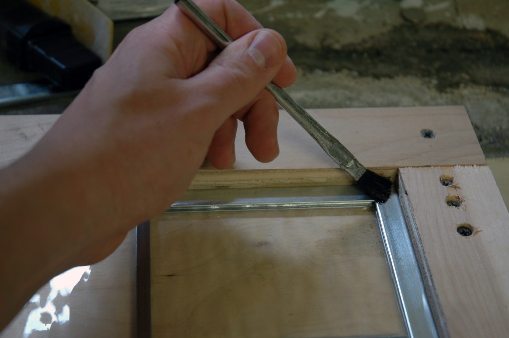 Apply flux to the joints using an acid brush. 