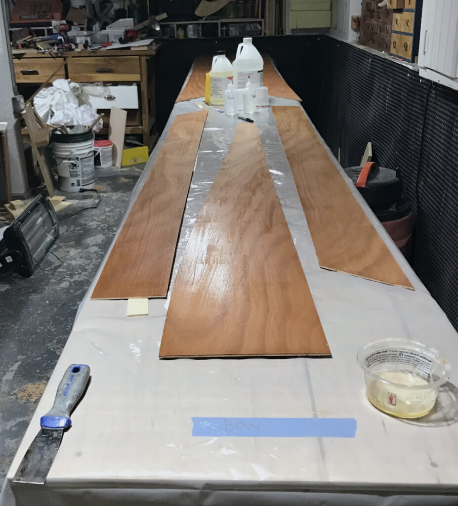 Fiberglass tape and epoxy join lengths of plywood to form planks